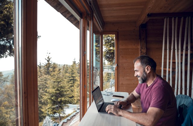 Young businessman working from home with his laptop.