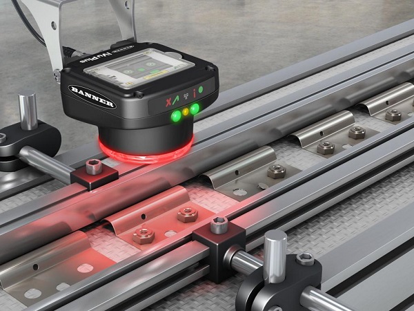 A bar code sensor is kept on the steel slider for quality control applications.
